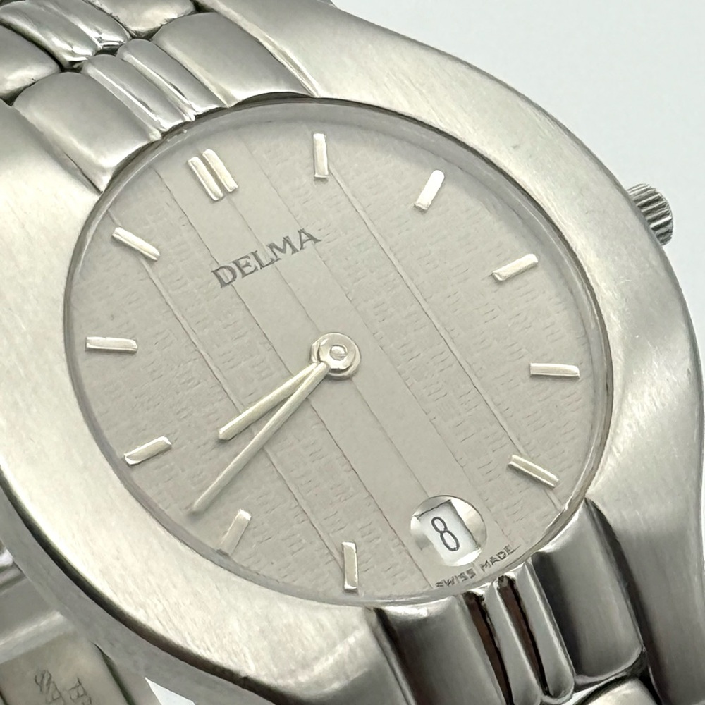 Delma Swiss made watch, 34mm size case, 7in size wrist bracelet